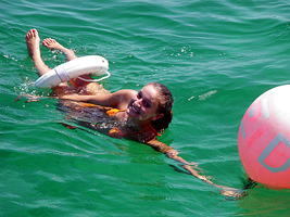 swimming behind boat on Key Biscayne